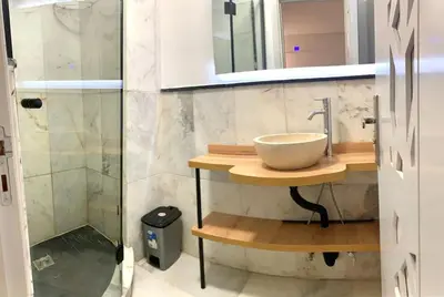 a bathroom with a bowl sink and a shower at 2-Bedroom Apart, Heart of Gueliz in Marrakech