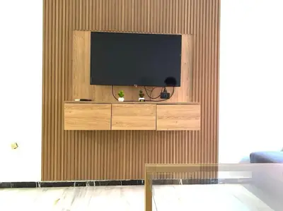 a living room with a television on a wall at 2-Bedroom Apart, Heart of Gueliz in Marrakech