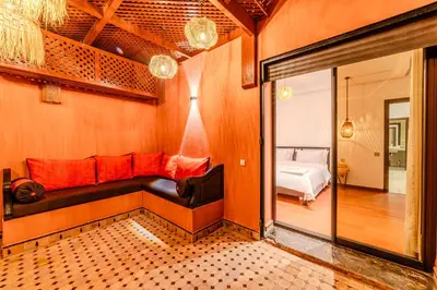 a room with a couch and a bed in a room at Luxury Apartment 3 Bedroom in CityCenter Marrakech in Marrakech