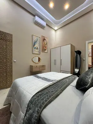 a bedroom with a large bed in a room at Superbe appartement à Marrakech in Marrakech