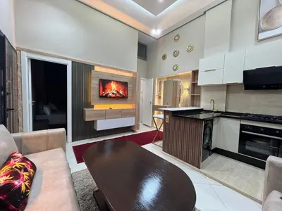 a living room with a fire in the fireplace at Superbe appartement à Marrakech in Marrakech