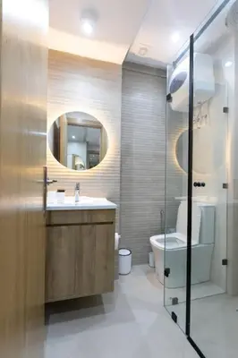 a bathroom with a sink and a toilet and a mirror at Chic urbain en plein centre in Marrakech