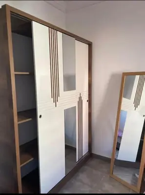 a mirror in front of a white closet at Appart in Marrakech 5G in Marrakech