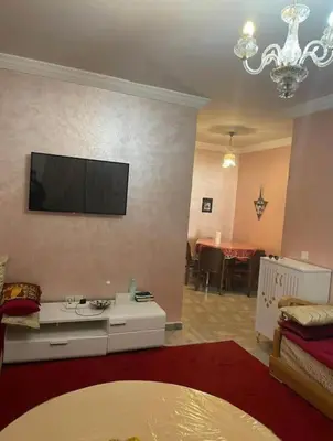 a living room with a flat screen tv on a wall at Appart in Marrakech 5G in Marrakech