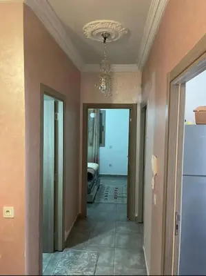 a room with a hallway with a chandelier on the ceiling at Appart in Marrakech 5G in Marrakech