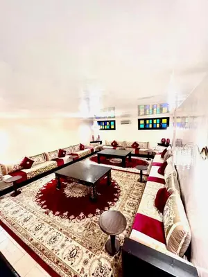 a large living room with couches and a table at Medley Luxury Villa - PARKING, WIFI & PISCINE in Marrakech
