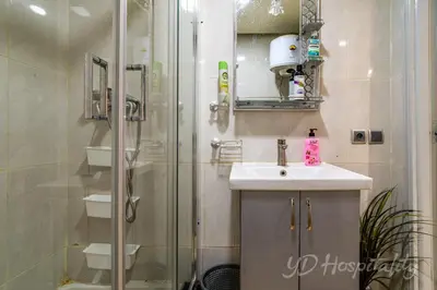 a bathroom with a shower and a sink and a shower at 5-Star Atlas Pearl well Centered in Marrakech