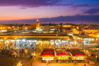 a night view of a market in a city at Cozy Studio center of Marrakech in Marrakech