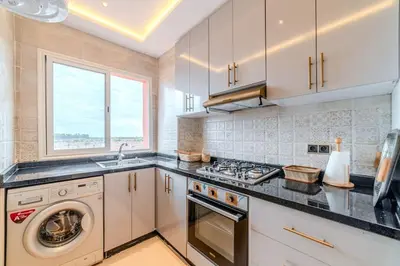 a kitchen with a stove and a dishwasher at 2Br Apartment 15 min from Jemaa el-Fnaa Marrakech in Marrakech
