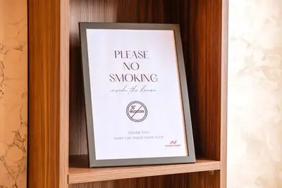 a picture of a framed sign on a wooden shelf at 2Br Apartment 15 min from Jemaa el-Fnaa Marrakech in Marrakech
