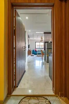 a hallway with a door open to a living room at 5-Star Suite in Prime Spot with Luxe Touches in Marrakech