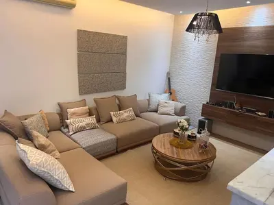 a living room with a couch and a table at Villa M à Marrakech in Marrakech