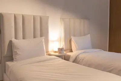 two beds sitting next to each other in a bedroom at Appartement au cœur de Marrakech in Marrakech