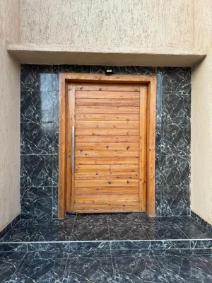 a wooden garage door on the side of a building at Villa S in Marrakech