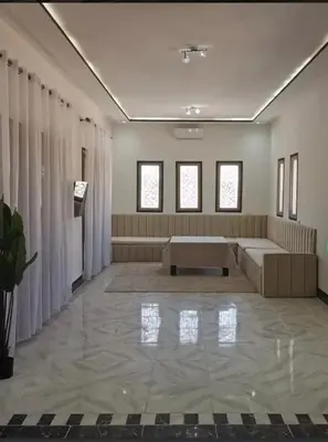 a large room with a couch and a table at Villa S in Marrakech