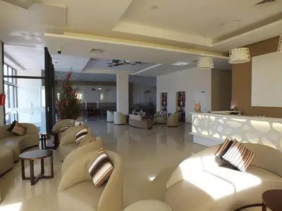 a large lobby with couches and a christmas tree at Hotel Relax Marrakech in Marrakech
