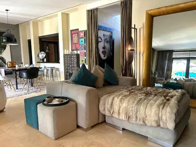 a living room with a couch and a table at Palais Bali in Marrakech
