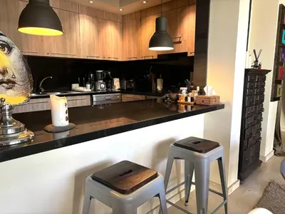 a kitchen with two stools and a counter top at Palais Bali in Marrakech