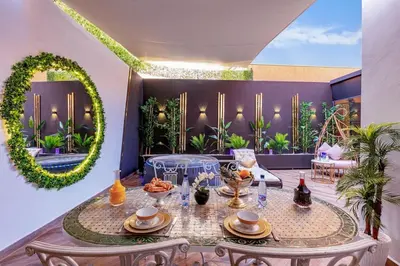 a living room with a table with food on it at Villa YOGA Guéliz Centre-Ville in Marrakech