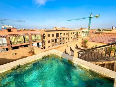 a large swimming pool on top of a building at Piscine Guéliz Center Yoga in Marrakech