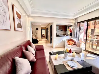 a living room with a couch and a table at Piscine Guéliz Center Yoga in Marrakech