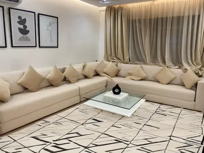 a living room with a couch and a table at Centre ville Marrakech Guéliz in Marrakech