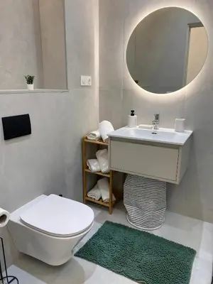 a bathroom with a sink and a toilet and a mirror at Centre ville Marrakech Guéliz in Marrakech