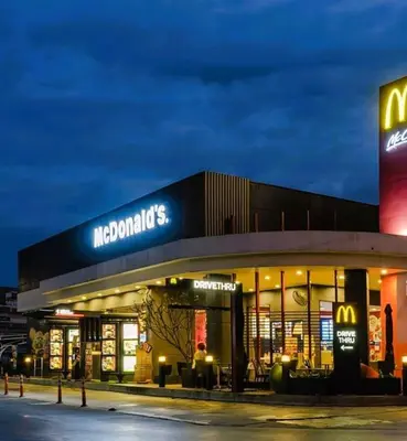 a mcdonalds store with a sign on top of it at Tulipe Family House-Pool and Parking in Marrakech