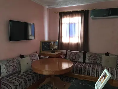 a living room with a couch and a table at Dari in Marrakech