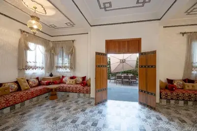 a large living room with couches and a table at Villa Targa in Marrakech