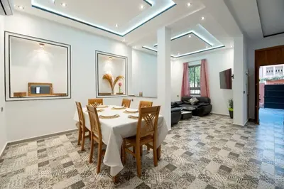 a dining room with a table and chairs at Villa Targa in Marrakech