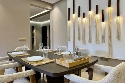 a dining room with a black table and chairs at Apartment in the heart of Marrakech in Marrakech