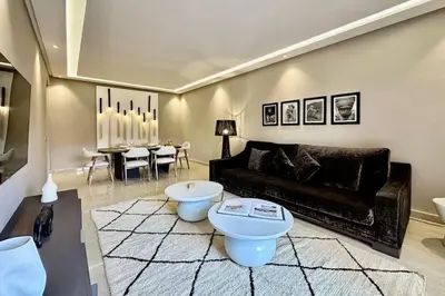 a living room with a couch and a table at Apartment in the heart of Marrakech in Marrakech