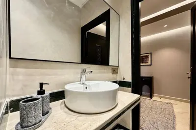 a bathroom with a white sink and a mirror at Apartment in the heart of Marrakech in Marrakech