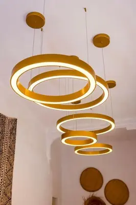 a group of gold chandeliers hanging from a ceiling at Riad Orb Private Riad Breakfast Included in Marrakech
