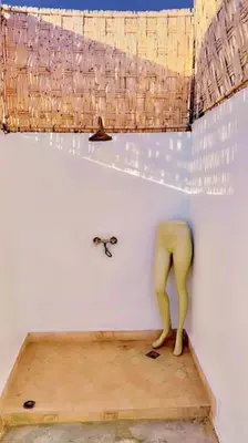 a mannequin standing on a wooden floor in a room at Riad Orb Private Riad Breakfast Included in Marrakech