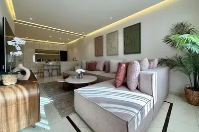 a living room with a couch and a table at Central Gueliz with Pool and Terrace in Marrakech
