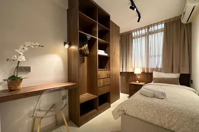 a bedroom with a bed and a desk and a chair at Central Gueliz with Pool and Terrace in Marrakech