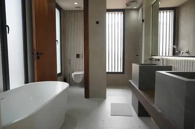 a bathroom with a tub and a sink and a toilet at Marrakech Oasis Retreat - 5-Bedroom Villa with Private Pool in El Makina