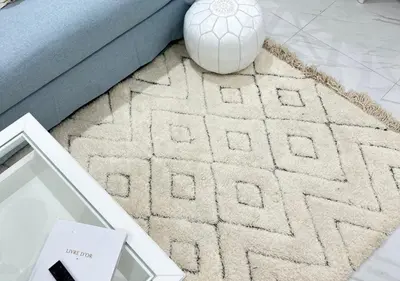 a rug with a soccer ball on top of a living room at Sérénité Berbère Appartement centre Marrakech in Marrakech