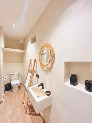 a bathroom with a sink and a mirror on the wall at Villa piscine privée sans vis à vis, 20 min du Centre - Fibre Optique Wifi in Marrakech