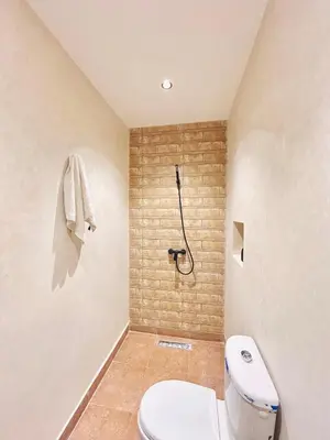 a bathroom with a toilet and a shower at Villa piscine privée sans vis à vis, 20 min du Centre - Fibre Optique Wifi in Marrakech