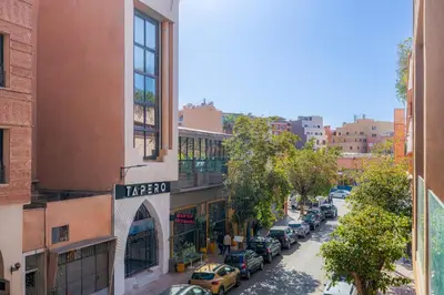 a city street with cars parked on the street at Bohochic#appartement#Gueliz in Marrakech