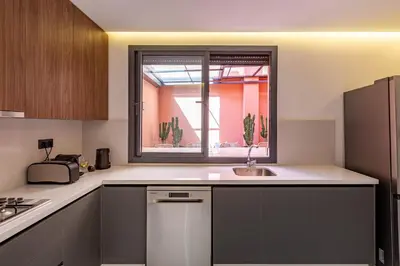a kitchen with a sink and a window at Duplex Luxury and Comfort in Heart of Gueliz in Marrakech