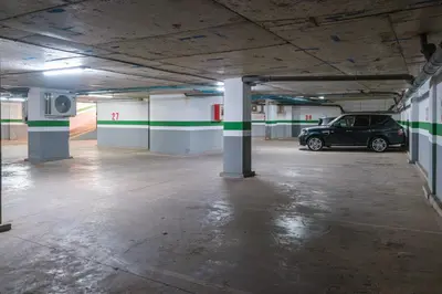 an empty parking garage with a car parked in it at Duplex Luxury and Comfort in Heart of Gueliz in Marrakech