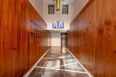 a hallway with wood paneled walls and a tile floor at elegance et modernite au coeur de la ville in Marrakech