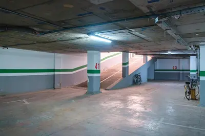 an empty parking garage with two bikes parked in it at Bohemian Style in Hyper-Center - Optical Fiber in Marrakech