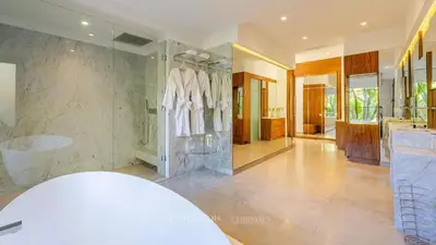 a bathroom with a walk in shower and a sink at VilLA AYDEN in Marrakech