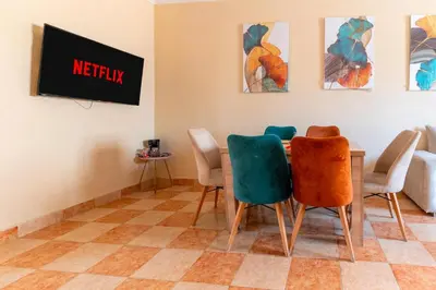 a waiting room with a table and chairs at Appartement à Marrakech in Marrakech