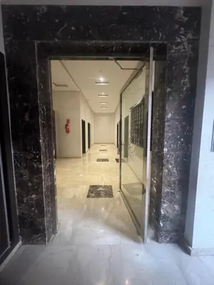 a hallway with a glass door in a building at Cosy-Appart in Marrakech